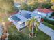 House with solar panels, pool, and lush landscaping at 14311 83Rd Pl, Seminole, FL 33776