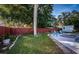 Landscaped backyard with privacy fence and pool area at 14311 83Rd Pl, Seminole, FL 33776