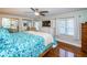 Spacious bedroom with king-size bed and large windows at 14311 83Rd Pl, Seminole, FL 33776