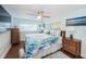 Light and airy bedroom with hardwood floors and ceiling fan at 14311 83Rd Pl, Seminole, FL 33776