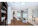 Upstairs hallway with hardwood floors and built-in shelves at 14311 83Rd Pl, Seminole, FL 33776