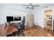 Bright home office with built-in desk and hardwood floors at 14311 83Rd Pl, Seminole, FL 33776