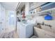 Laundry room with washer, dryer, and utility sink at 14311 83Rd Pl, Seminole, FL 33776