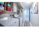 Bright laundry room with built-in shelving at 14311 83Rd Pl, Seminole, FL 33776