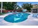 Inviting kidney-shaped pool with spa and patio area at 14311 83Rd Pl, Seminole, FL 33776