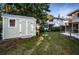 Charming light green storage shed in backyard setting at 14311 83Rd Pl, Seminole, FL 33776