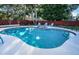 Inviting kidney-shaped pool with spa and plenty of yard space at 14311 83Rd Pl, Seminole, FL 33776