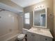 Updated bathroom with a vanity, toilet, and shower/tub combo at 15716 Country Lake Dr, Tampa, FL 33624