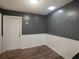 Simple dining area with grey walls and wood flooring at 15716 Country Lake Dr, Tampa, FL 33624