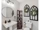 Elegant powder room with pedestal sink and decorative accents at 15927 Ternglade Dr, Lithia, FL 33547