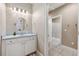 Bright bathroom boasts a vanity with blue countertop and a walk-in shower at 15927 Ternglade Dr, Lithia, FL 33547