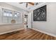 Charming bedroom featuring wood-look floors and large clock at 15927 Ternglade Dr, Lithia, FL 33547