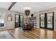 Open dining area with round table, black chairs, and hardwood floors at 15927 Ternglade Dr, Lithia, FL 33547