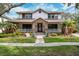 Two-story home with a wraparound porch and landscaping at 15927 Ternglade Dr, Lithia, FL 33547