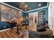 Dark-walled home office with a unique desk setup and French doors at 15927 Ternglade Dr, Lithia, FL 33547