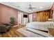 Main bedroom with a king-size bed and barn-style closet doors at 15927 Ternglade Dr, Lithia, FL 33547