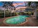 Inviting kidney-shaped pool with a screened enclosure at 15927 Ternglade Dr, Lithia, FL 33547