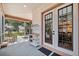 Relaxing screened porch with rocking chairs and outdoor seating at 15927 Ternglade Dr, Lithia, FL 33547