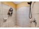 Clean shower with tile surround and built-in shelving at 15927 Ternglade Dr, Lithia, FL 33547