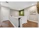 Upstairs hallway with wood floors and accent wall at 15927 Ternglade Dr, Lithia, FL 33547