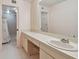 Clean bathroom with vanity, large mirror, and access to the shower at 1601 43Rd N St # 133, St Petersburg, FL 33713