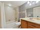 Bathroom with shower, toilet, and wood vanity at 1601 43Rd N St # 133, St Petersburg, FL 33713