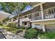 Front view of a condo building showcasing its architecture and landscaping at 1601 43Rd N St # 133, St Petersburg, FL 33713