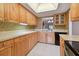 Kitchen with light wood cabinets and a neutral color palette at 1601 43Rd N St # 133, St Petersburg, FL 33713