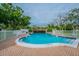 Relaxing kidney-shaped pool with brick deck at 1601 43Rd N St # 133, St Petersburg, FL 33713