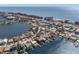 Aerial view of a waterfront home near beach and city at 17020 Dolphin Dr, North Redington Beach, FL 33708