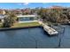 Waterfront property featuring a private dock and refreshing pool at 17020 Dolphin Dr, North Redington Beach, FL 33708