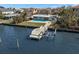 Aerial view of a waterfront home with a private dock and pool at 17020 Dolphin Dr, North Redington Beach, FL 33708