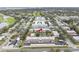 Aerial view of condo community showing building, pool, and parking at 1750 Belleair Forest Dr # A15, Belleair, FL 33756