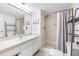 Clean bathroom with shower/tub combo and vanity at 1750 Belleair Forest Dr # A15, Belleair, FL 33756