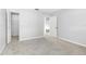 Well-lit bedroom with carpet flooring and closet at 1750 Belleair Forest Dr # A15, Belleair, FL 33756