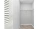 Spacious closet with wire shelving for convenient storage at 1750 Belleair Forest Dr # A15, Belleair, FL 33756