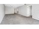 Living room with gray carpet and access to other rooms at 1750 Belleair Forest Dr # A15, Belleair, FL 33756