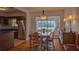 Dining room with wood table and chairs, and a view of the kitchen at 1900 41St N St, St Petersburg, FL 33713