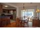 Bright dining area with a view into the kitchen and a sunroom at 1900 41St N St, St Petersburg, FL 33713