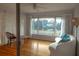 Living room with hardwood floors, white couch, and lake view at 1900 41St N St, St Petersburg, FL 33713