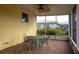 Relaxing screened porch with seating area and a view of the backyard at 1900 41St N St, St Petersburg, FL 33713