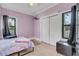 Bedroom with tiled floor, closet, and two windows providing natural light at 2070 28Th St, Sarasota, FL 34234