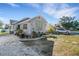 Beautiful home exterior showcasing well-maintained landscaping, a decorative water feature, and a spacious driveway at 2070 28Th St, Sarasota, FL 34234