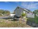 Charming exterior featuring updated siding, landscaping, and a decorative water feature in the front yard at 2070 28Th St, Sarasota, FL 34234