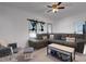 Comfortable living room featuring a large sectional sofa, neutral carpeting, and natural light from the windows at 2070 28Th St, Sarasota, FL 34234