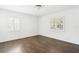 Bright bedroom with hardwood floors and two windows with shutters at 216 23Rd N Ave, St Petersburg, FL 33704