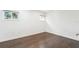 Simple bedroom with hardwood floors and two windows at 216 23Rd N Ave, St Petersburg, FL 33704