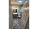 Bathroom boasts patterned tile flooring, updated vanity and shower at 22065 Malone Ave, Port Charlotte, FL 33952