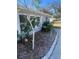 Up close picture shows well maintained landscaping against the freshly painted exterior walls at 22065 Malone Ave, Port Charlotte, FL 33952