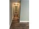 Hallway with updated wood-look floors and light-colored walls, creating a clean and modern feel at 22065 Malone Ave, Port Charlotte, FL 33952